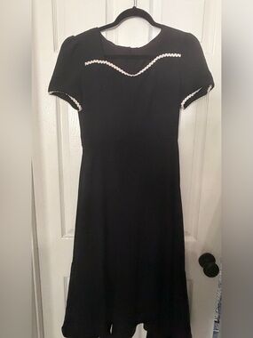 Elegant Black Dress with White Trim